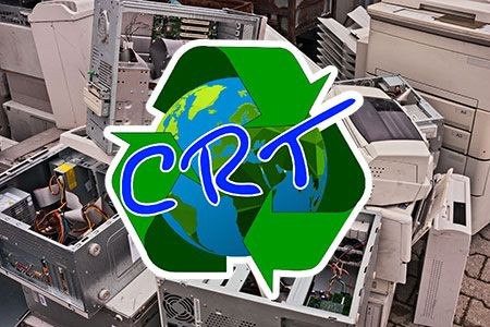 Electronic waste pile with a recycling symbol and 'CRT' text overlay.